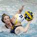 A Saline player attempts to defend in the game against Grand Haven on Friday, April 19. AnnArbor.com I Daniel Brenner